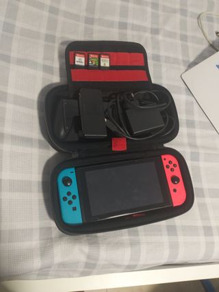 Nintendo Switch con juegos y cargador