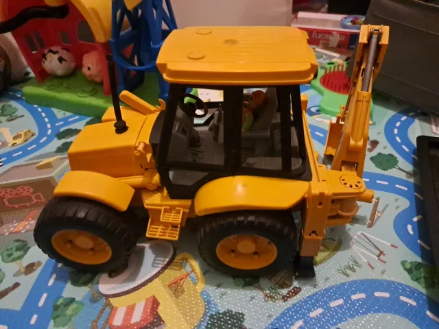 Excavadora JCB amarilla de juguete