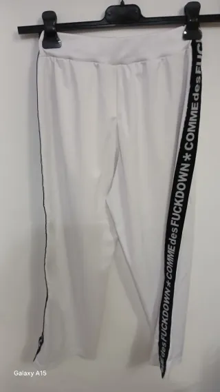 Pantaloni a gamba ampia bianchi con banda laterale