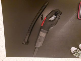 Aspirador de mano con manguera