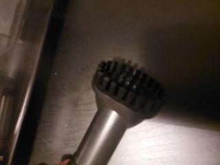 Aspirador de mano con manguera