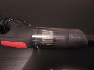 Aspirador de mano con manguera