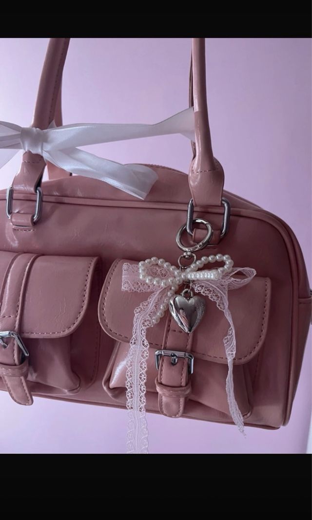 Borsa rosa in pelle con fiocco