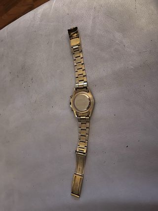Reloj Rolex Dorado y Negro