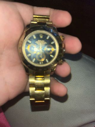 Reloj Rolex Dorado y Negro