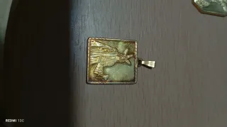 Medallita bañada en oro de la cena