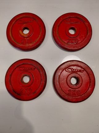 8 pesas 1Kg y 4 pesas de 2 Kg