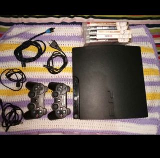 Consola PS3 con 2 mandos y juegos