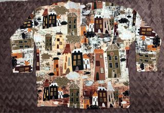 Jersey estampado casas y pájaros.