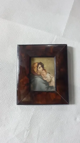 Petit quadre de motius religiosos.