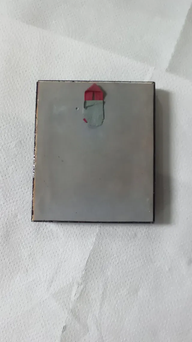 Petit quadre de motius religiosos.