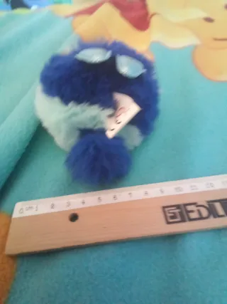 Peluche conejito raro azul y menta