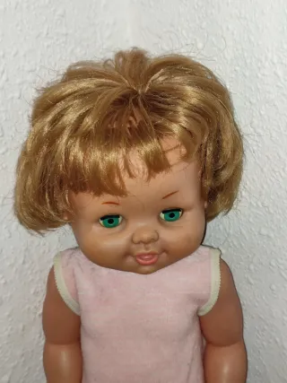 Muñeca antigua rubia ojos verdes