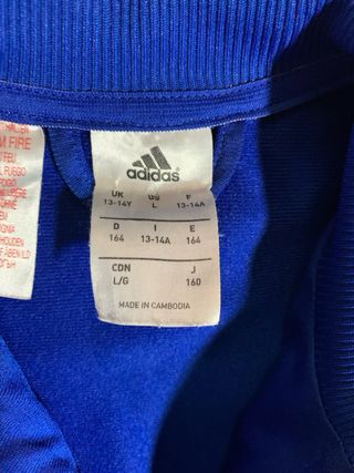 Chaqueta deportiva Adidas azul y blanca