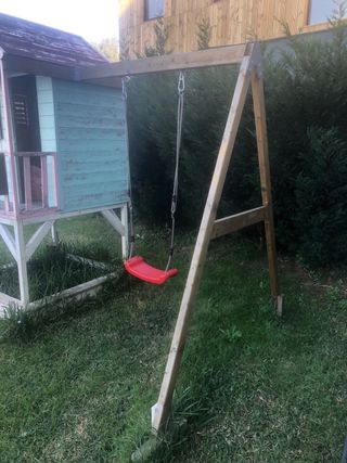 Casa de madera para niñas con tobogán