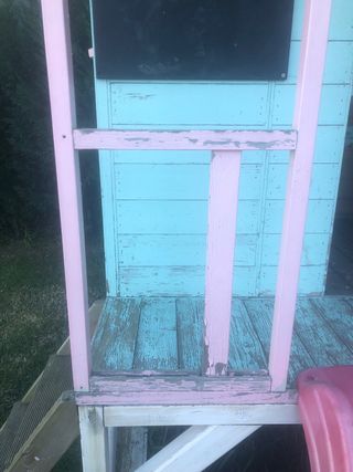 Casa de madera para niñas con tobogán