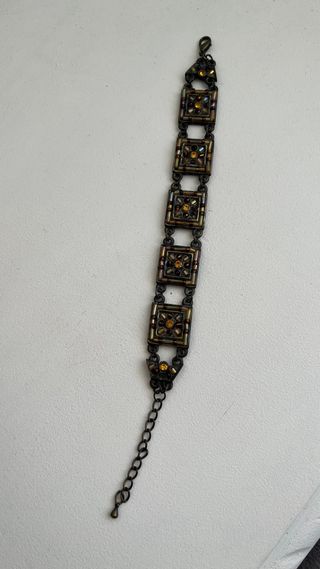 Pulsera de bisutería dorada y cobriza