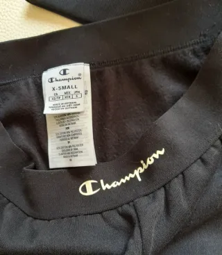 Tuta Champion nera taglia XS