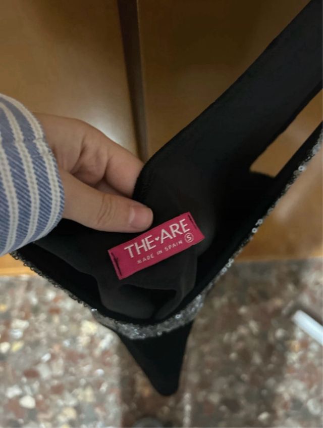 Top brillos the are plateado y negro