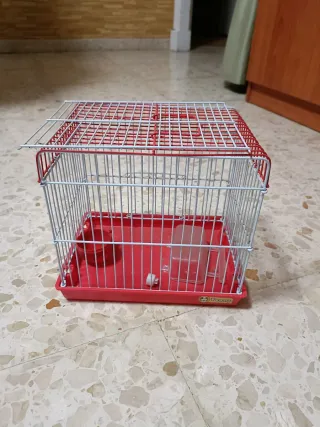 Jaula para pájaros pequeña roja