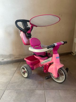 Triciclo infantil rosa con capota