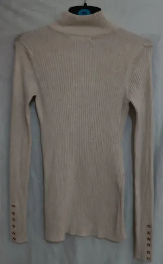 Jersey Sfera cuello alto beige.