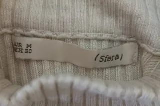 Jersey Sfera cuello alto beige.