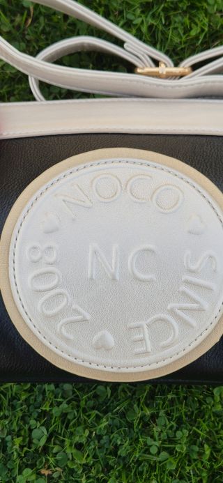 Bolso Noco Negro y Blanco,
 Tiene la etiqueta

