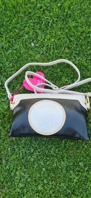 Bolso Noco Negro y Blanco,
 Tiene la etiqueta


