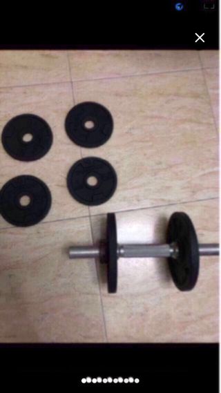 Pesas para gimnasio y barra
