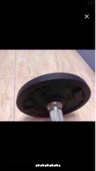 Pesas para gimnasio y barra