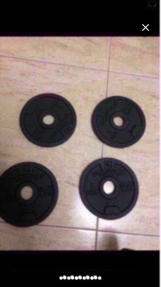 Pesas para gimnasio y barra
