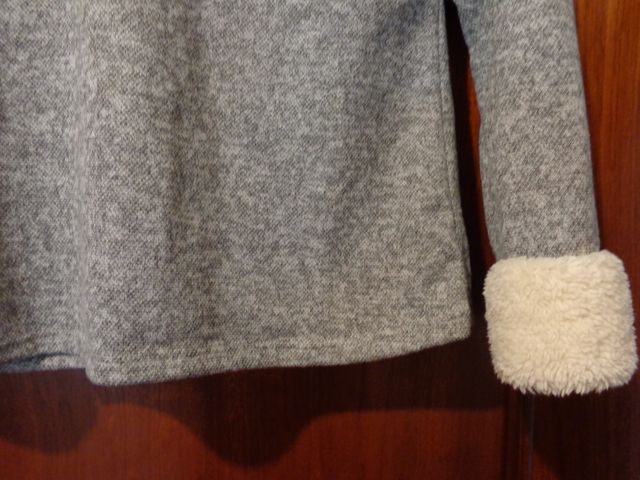 Jersey gris con puños de pelo