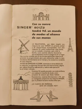 Máquina de coser Singer blanca y azul