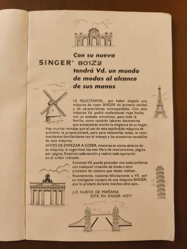 Máquina de coser Singer blanca y azul