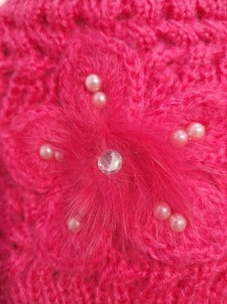 Gorro de lana rosa para niña con flor