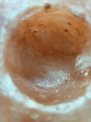 Portacandele in pietra rosa