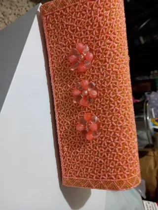 Bolso de fiesta rosa y dorado