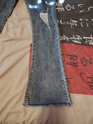 Pantalón vaquero mujer campana rotos talla 38