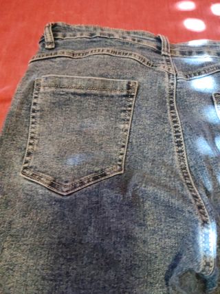 Pantalón vaquero mujer campana rotos talla 38