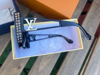 Gafas de sol Louis Vuitton negras y doradas