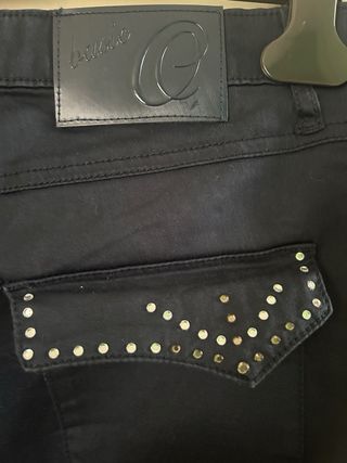 Pantaloni donna blu con borchie