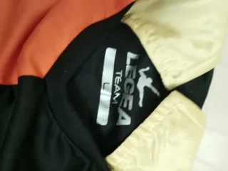 Completo calcetto Legea arancione/nero