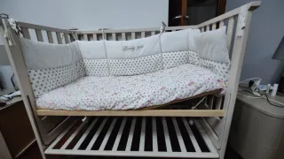 Culla per neonato con sponda abbassabile