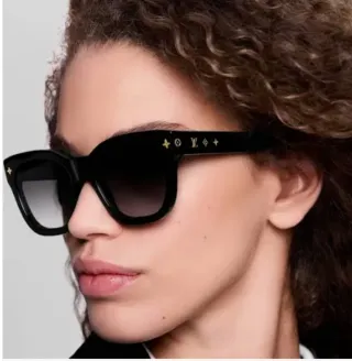 Gafas de sol Louis Vuitton negras y doradas 