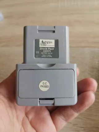 Nintendo 64 grigio con controller, memoria e 3 giochi.