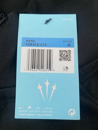 Tuta Nike NOCTA nera e oro
