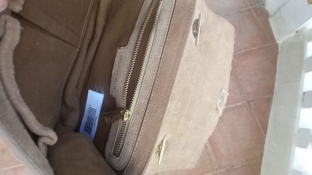 Bolso flecos ante George Rech