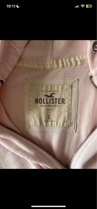 Sudadera rosa con capucha y cremallera