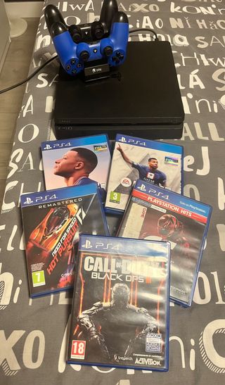 PS4 1TB Negra + 5 Juegos+2 mandos y cargador mando